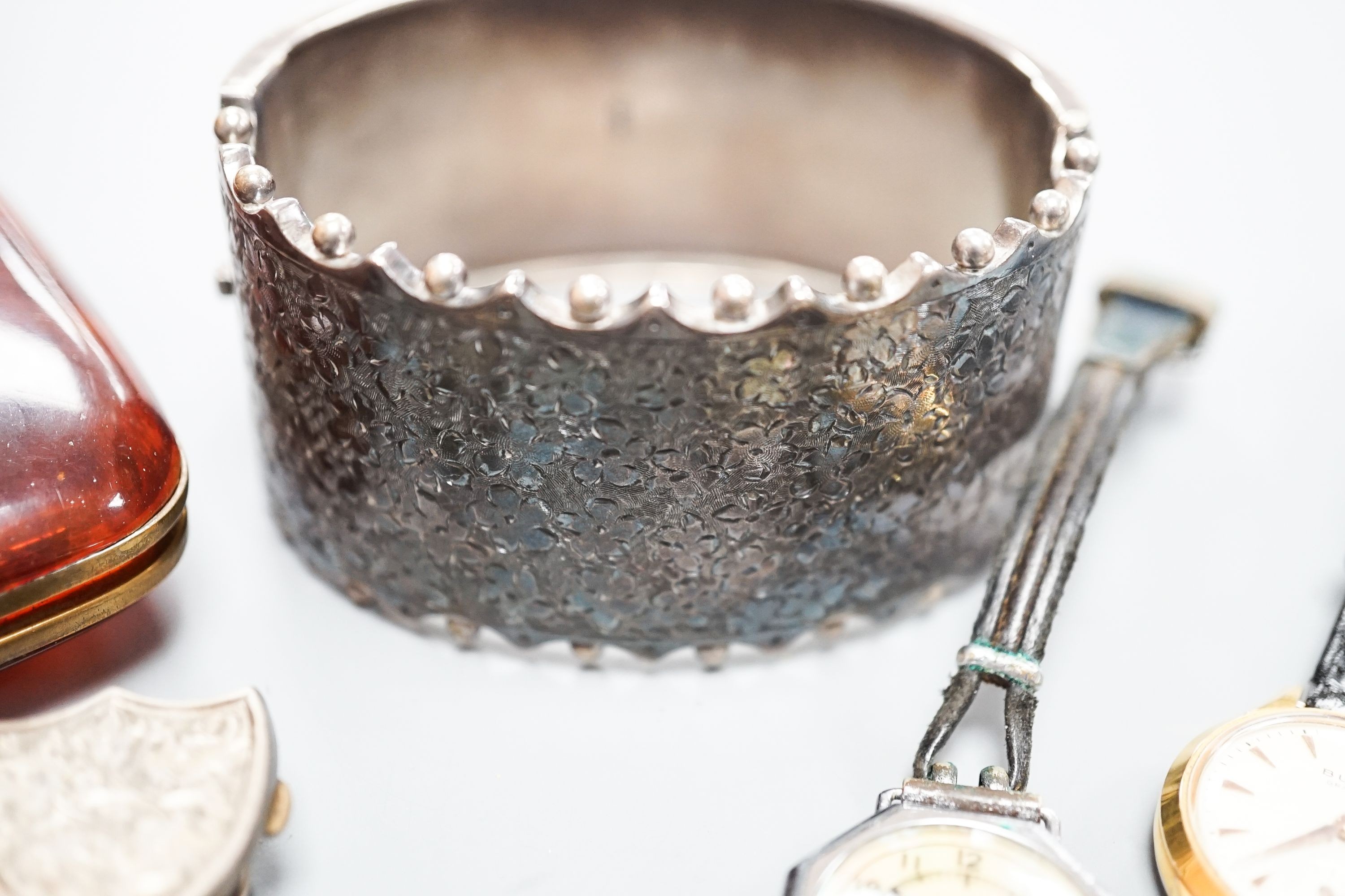 An engraved silver bangle, two silver brooches, including Scottish, two lady's wrist watches and a small group of minor jewellery, etc.